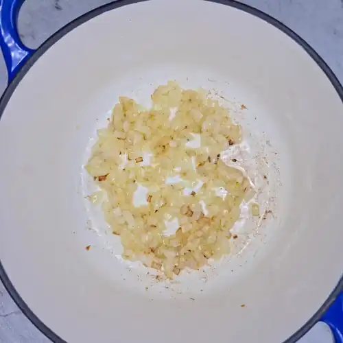  Finely chopped onion cooked in oil in a pot until soft, translucent and lightly browned. 