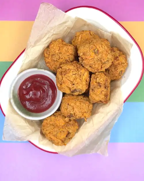  Veggie Nuggets on a plate with a dipping bowl of tomato sauce. Veggie Nuggets ready to eat.  